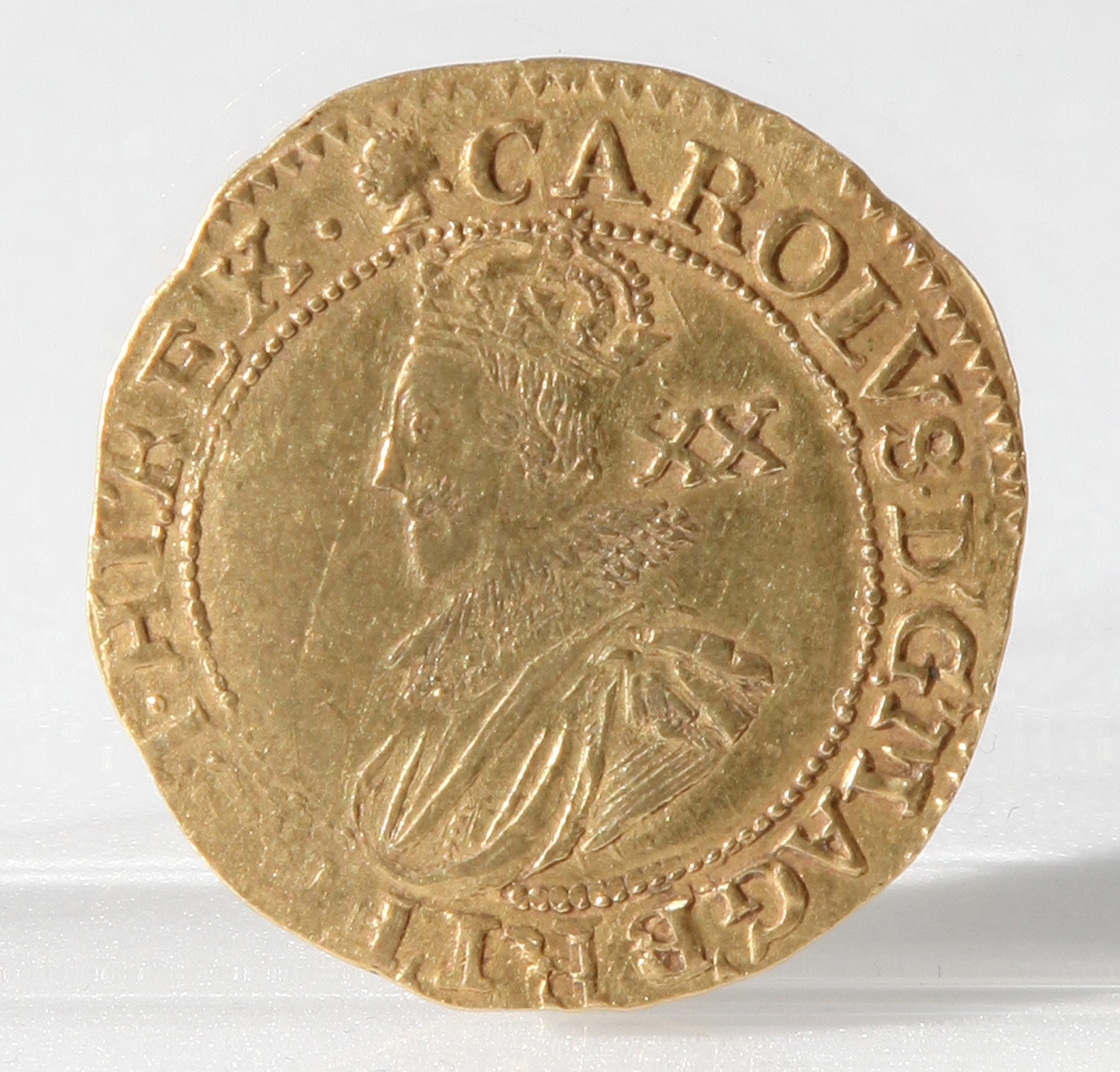 An image of the head side of a gold coin