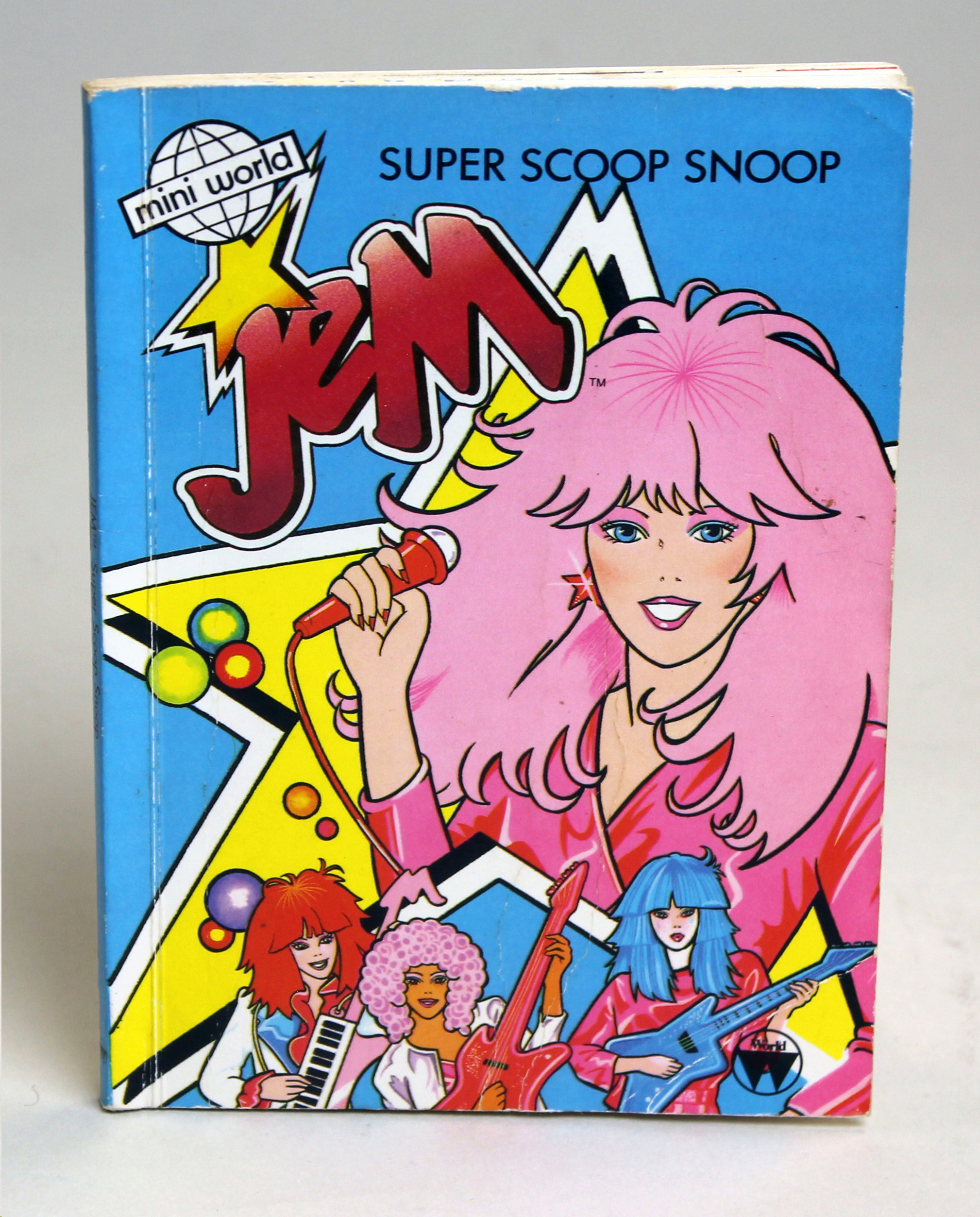 Colour photograph of a mini comic book featuring Jem and her band on the cover. Jem has pink hair and is holding a microphone