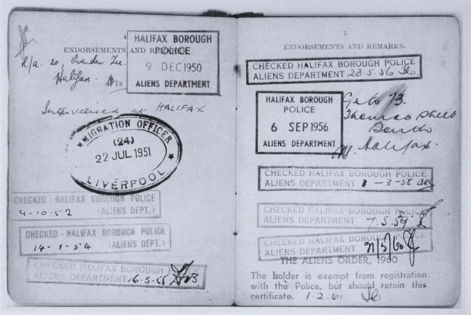 An 'alien' registration card with police stamps