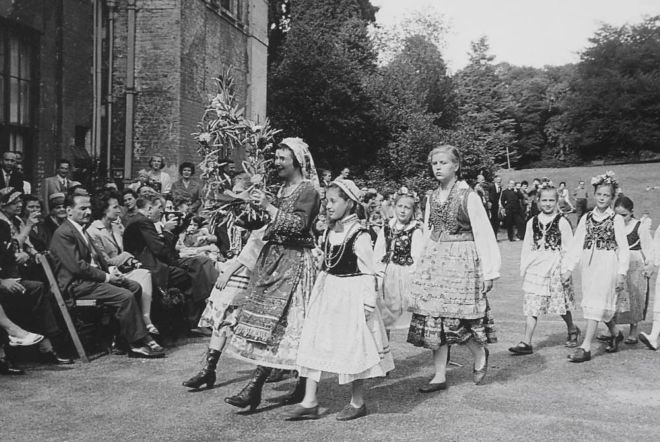 Children in traditional Polish costumes performing a folk dance c.1950s