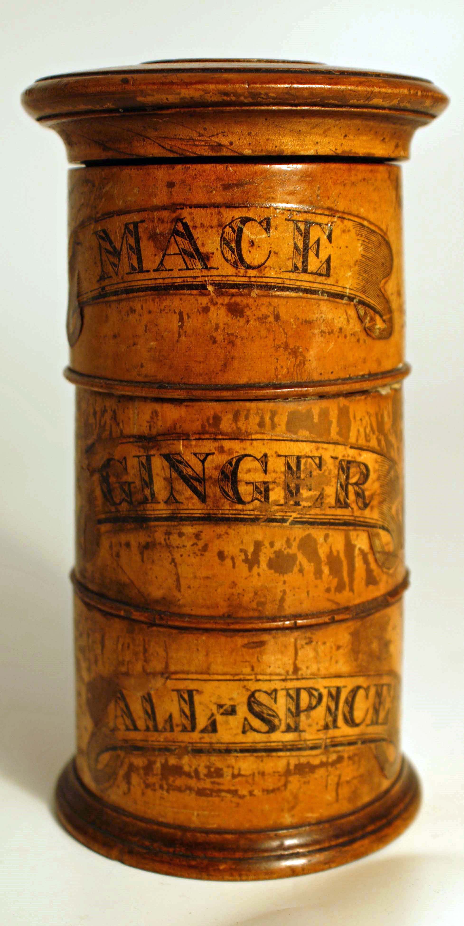 Colour photograph of a wooden spice tower with three separate compartments for different spices
