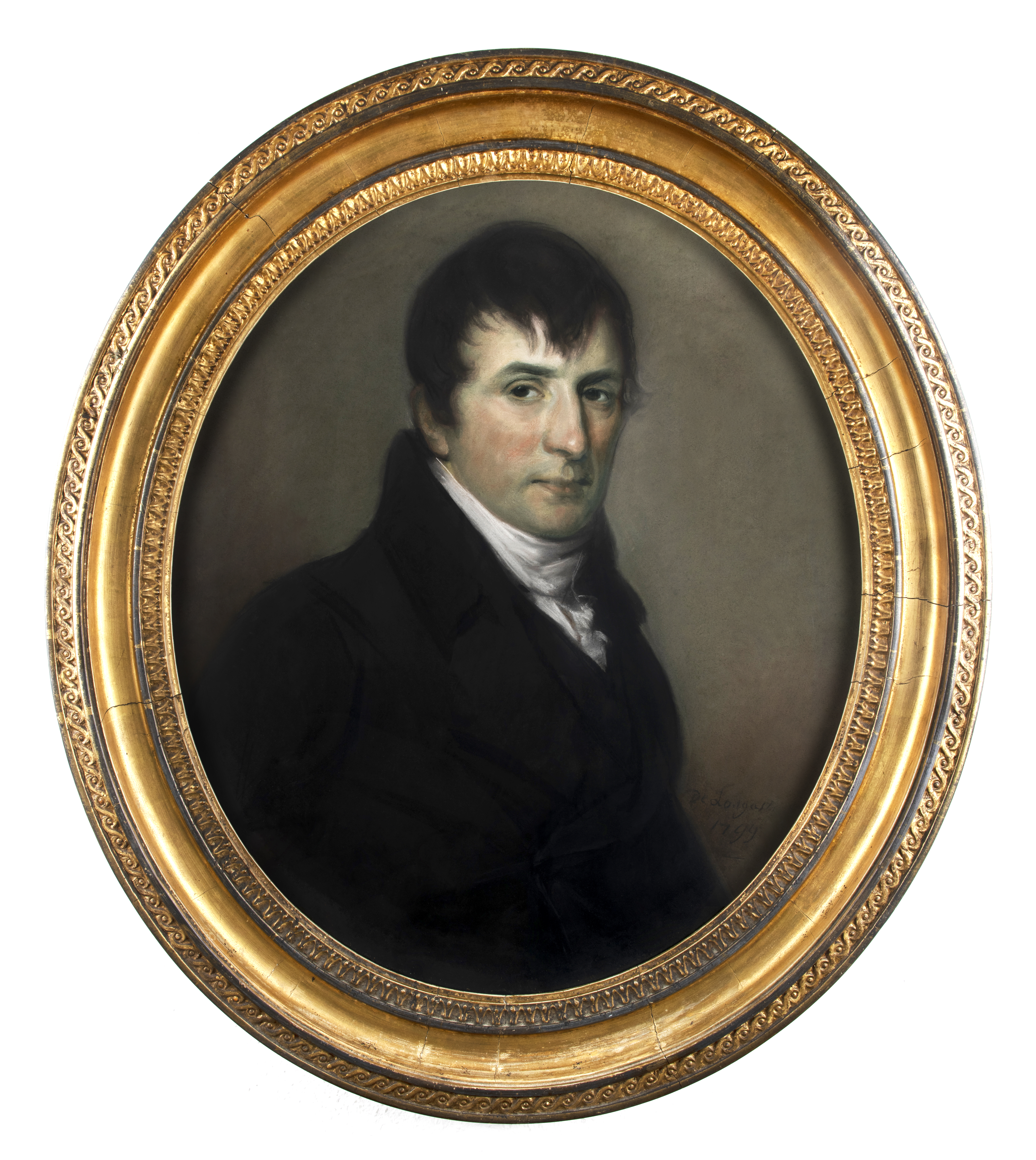 Painted portrait of a White man. He has black hair and dark eyes. He is wearing a black coat with a white shirt underneath. The painting is framed in a gold coloured oval shaped frame.