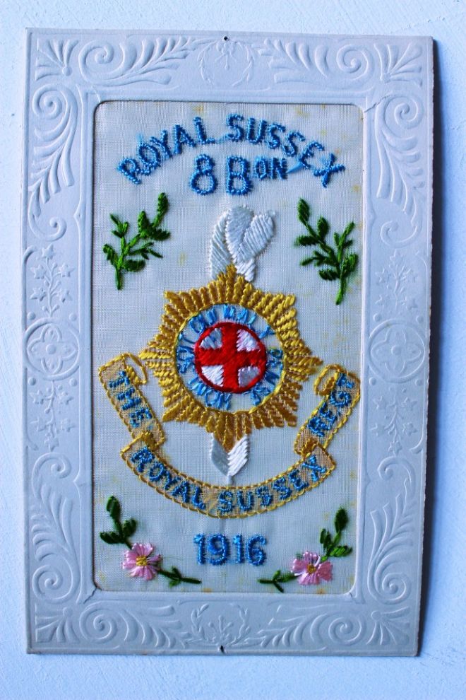 Embroidered silk WW1 postcard with regimental badge and flowers