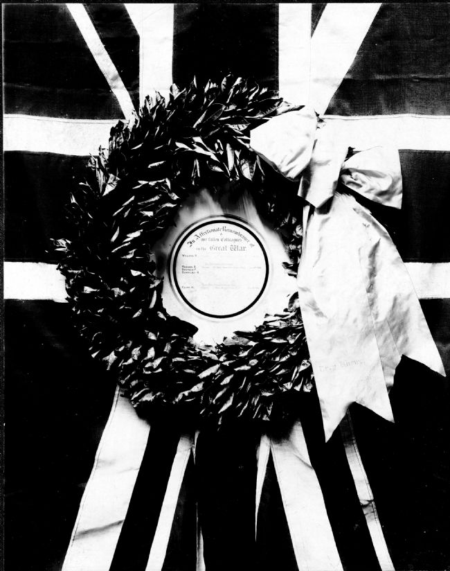 Black and white photograph of a memorial WW1 wreath with central inscription