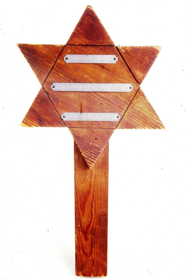 Wooden grave marker in the shape of a Star of David
