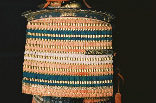 Stripes of coloured armour, in reds, pinks and blues.