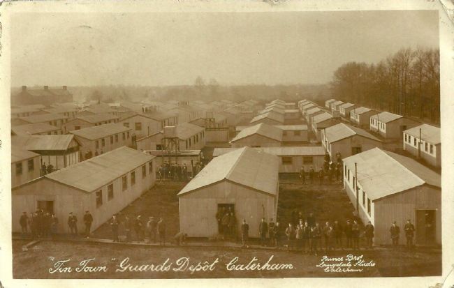 Photograph of Catherham Tin Town showing large, long buildings in rows.