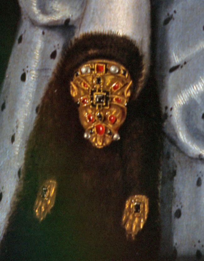 Close up of the flea fur, showind a dark brown piece of fur with bejewelled areas in teh shape of an animals head and paws.