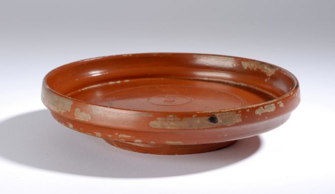 A red clay Roman intact plate