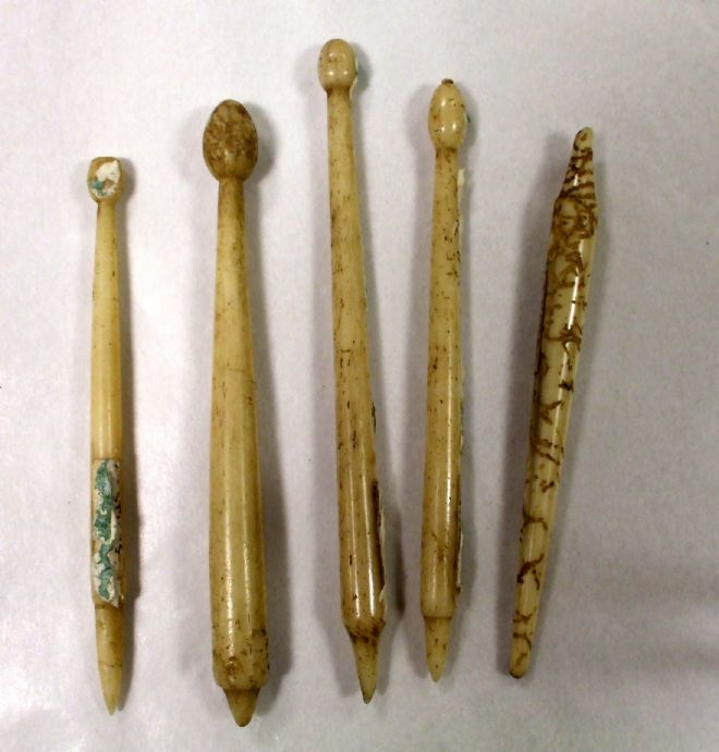 Styli made from bone with a pointed end for writing and a more rounded end for erasing mistakes.