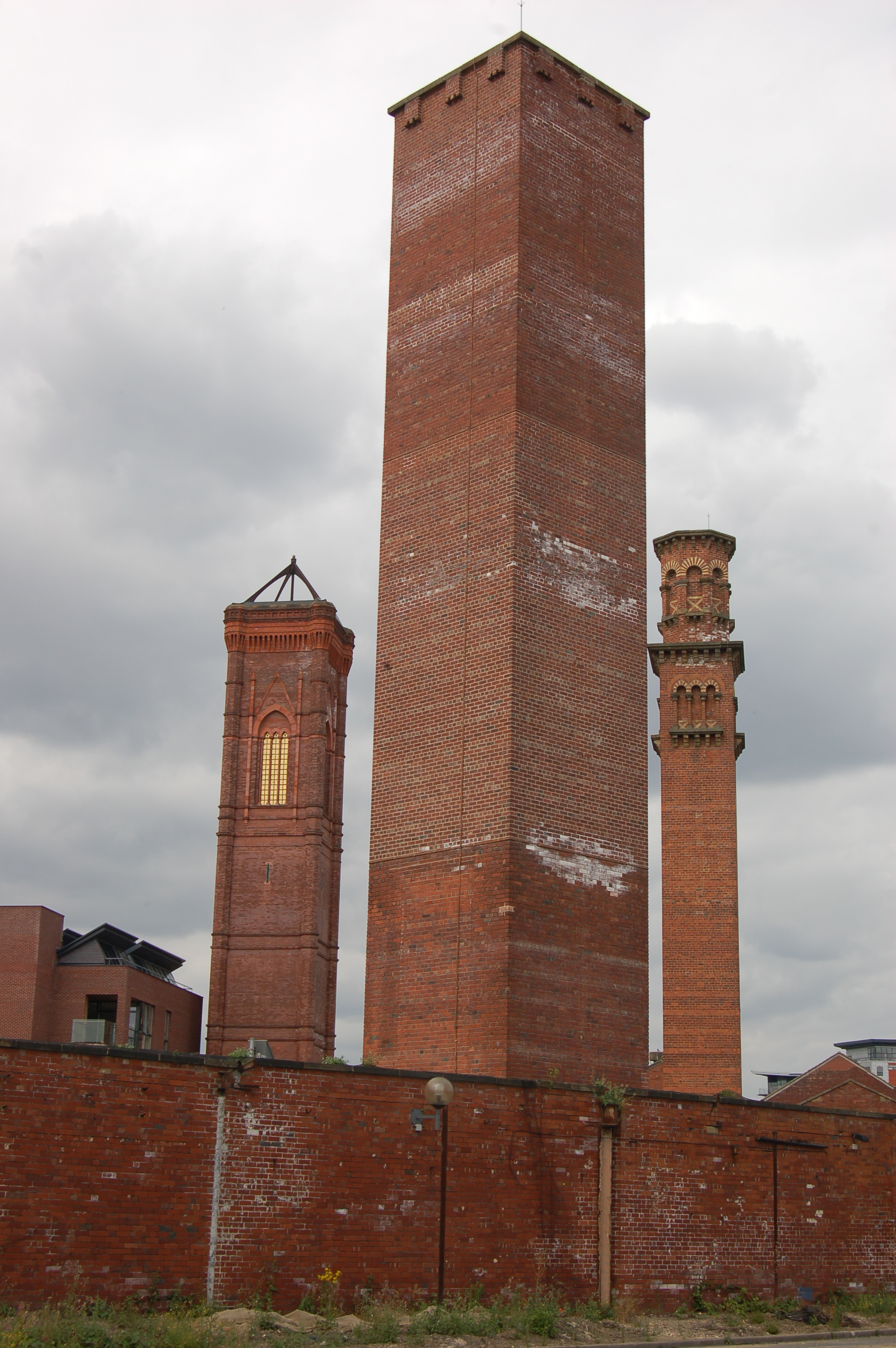 Contemporary photograph showing three brick towers.