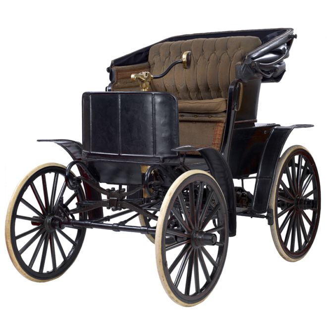 Open car that looks more like a carriage.  There is a steering handle, like the tiller of a boat, rather than a wheel