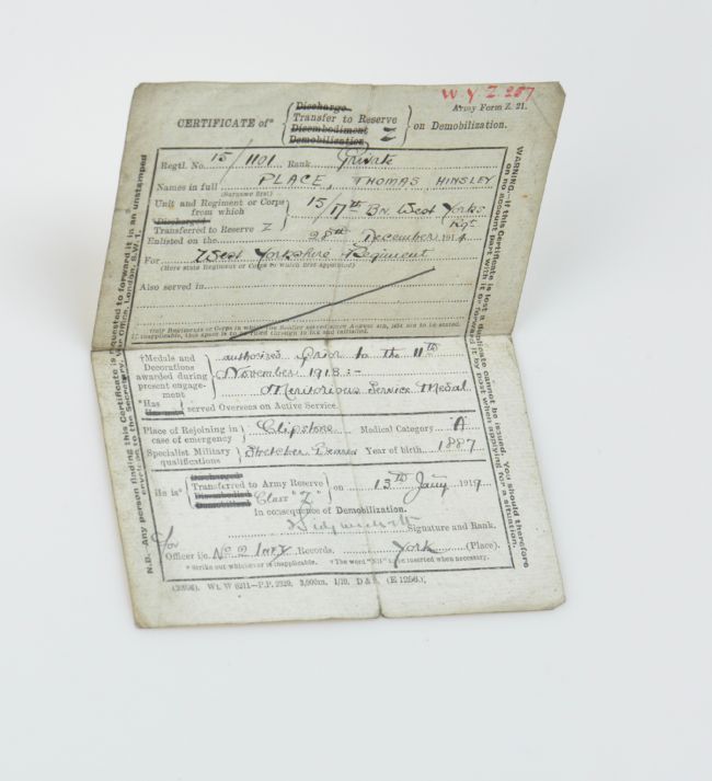 Photograph of certificate with typed and hand-written text