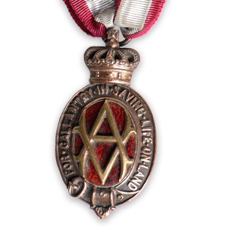 Gold WW1 Albert Medal, with letter 'A' in the centre, hanging from red and white ribbon