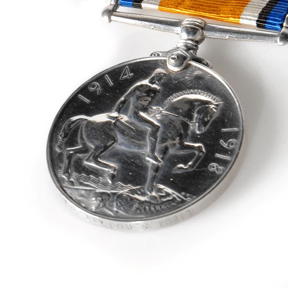 Reverse of British War Medal showing a figure on a horse with the dates 1914  and 1918 around the edge.
