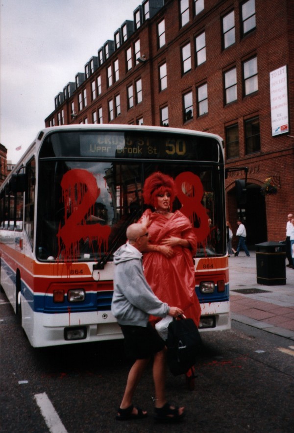 Drag Queen in Front of a Bus