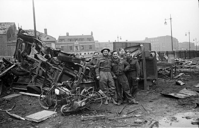 Photo of men standing next to rubble on Ferensway, Hull