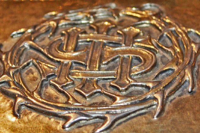 Detail of a silver gilt box given to York Minster in memory of George Ambler showing the raised crown of thorns on the lid
