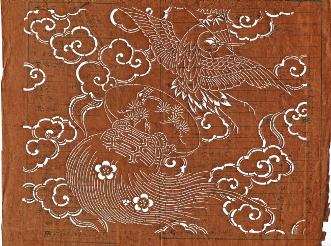 Japanese katagami stencil design telling story of Urashima Taro.  It shows a bird flying among clouds and a styalized turtle