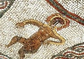 Colour photograph of a close up of part of the mosaic showing a figure.