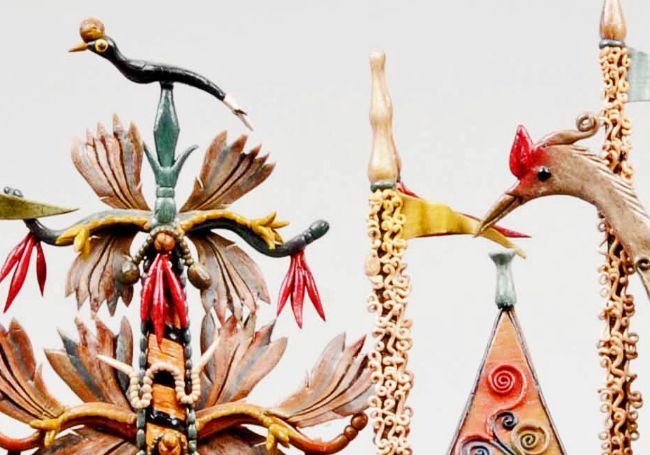 Close up of the top of the ship sculpture showing birds and intricate designs