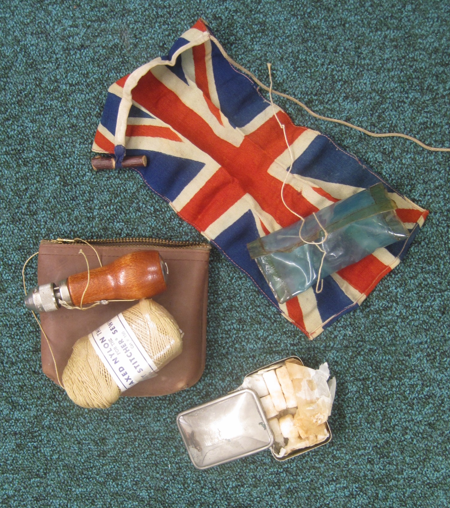 Selection of items used on Guide International Service expeditions during WW2, including a Union Flag.